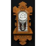 An early 20th century American oak gingerbread wall clock, by The Ansonia Clock Company, 13cm