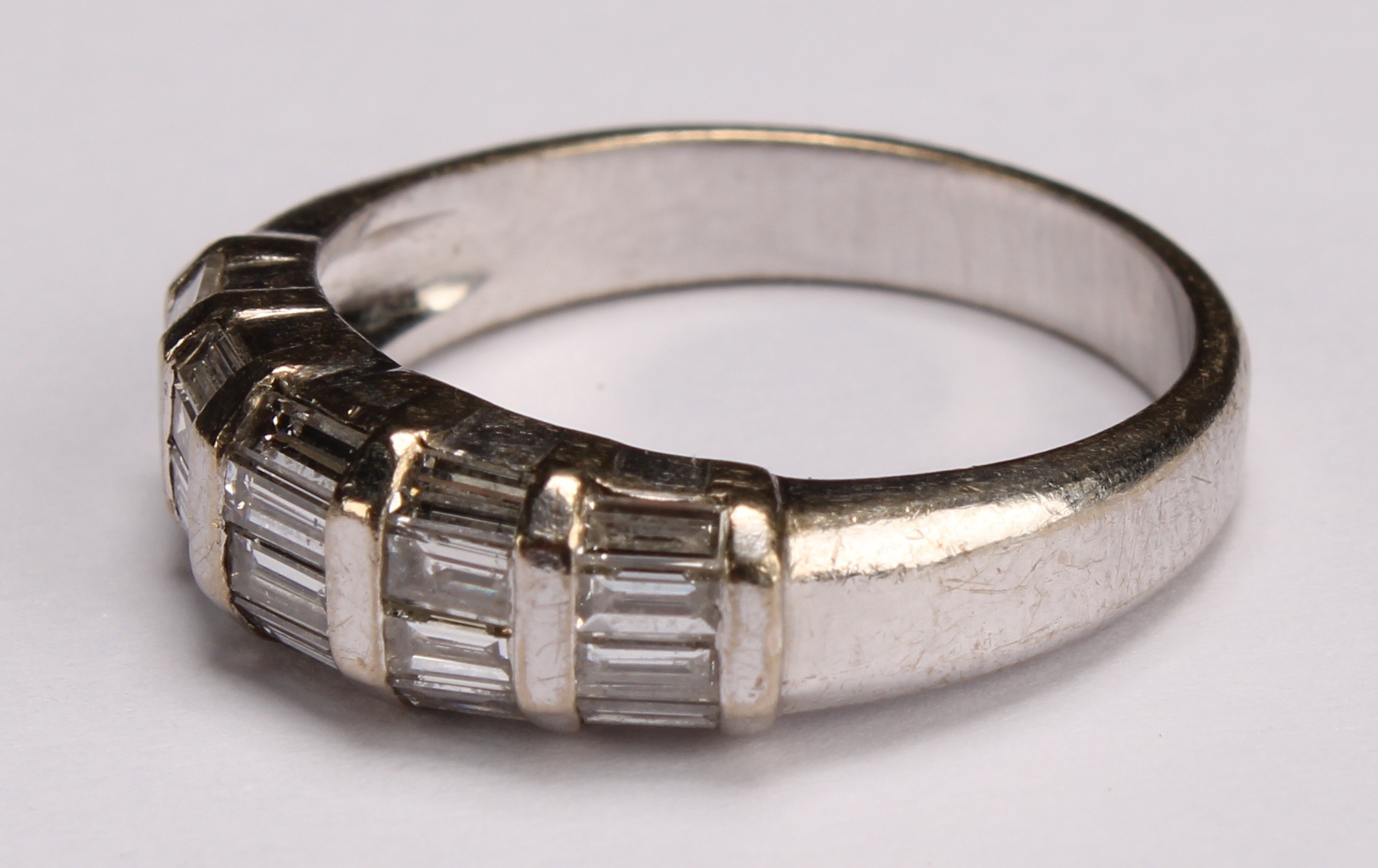 A diamond and 18ct white gold ring, with five bands of baguette cut stones, ring size M, 5.3g gross - Image 3 of 4