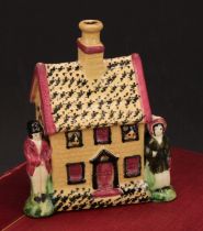 A Yorkshire Prattware polychrome spongeware cottage money box, moulded in relief with a figure to
