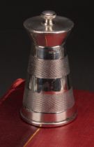 An Art Deco style silver spreading cylindrical pepper grinder, engine turned in three broad bands,