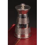 An Art Deco style silver spreading cylindrical pepper grinder, engine turned in three broad bands,