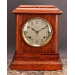 An early 20th century simulated rosewood mantel clock, 14.5cm circular silvered dial inscribed