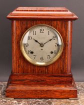 An early 20th century simulated rosewood mantel clock, 14.5cm circular silvered dial inscribed