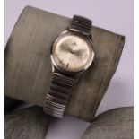 A gentleman's 1960s Jaeger Le Coultre stainless steel watch, champagne dial, baton indicators,