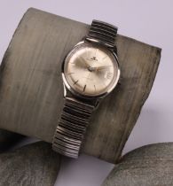 A gentleman's 1960s Jaeger Le Coultre stainless steel watch, champagne dial, baton indicators,
