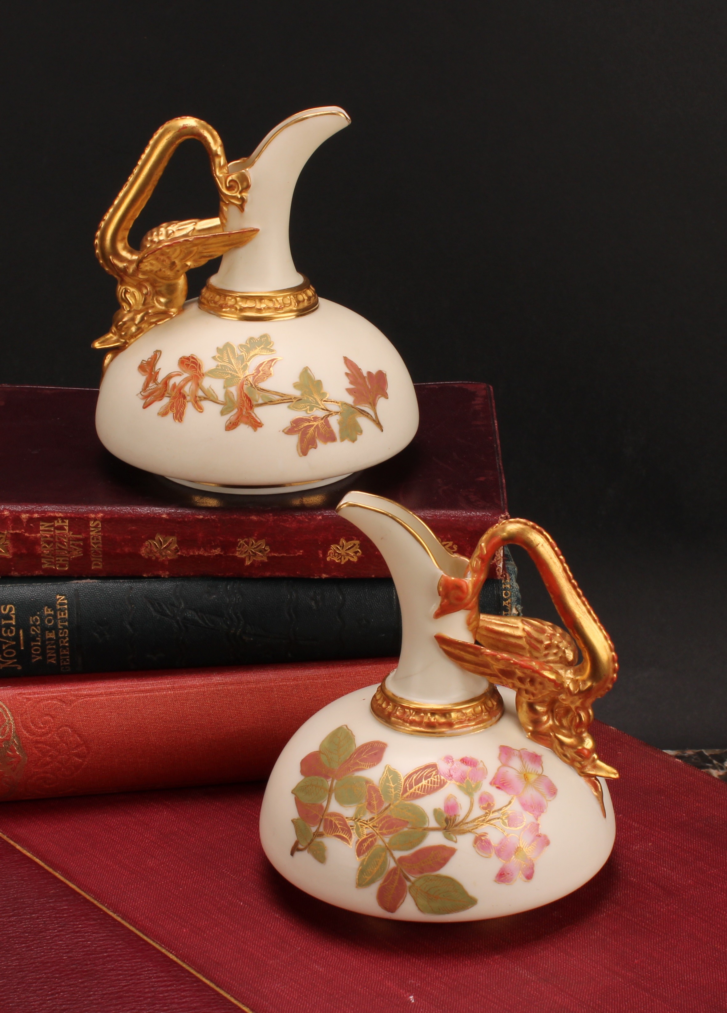 A pair of Royal Worcester ewers, of compressed form, decorated in the Aesthetic manner with