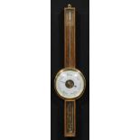 An early to mid 20th century oak wheel barometer, 19.5cm circular register inscribed DEMONSTRATION