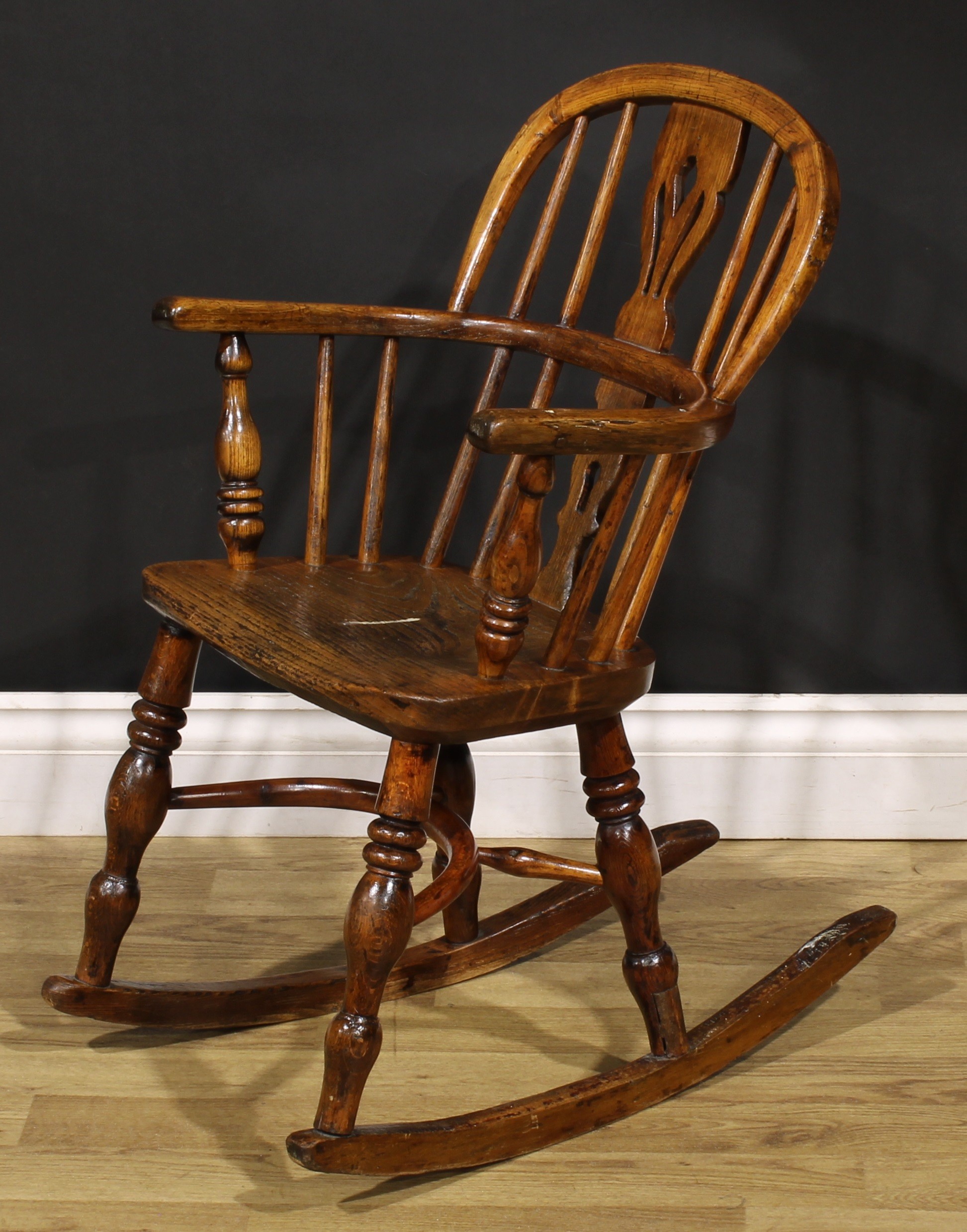 A 19th century ash and elm child’s Windsor rocking chair, pierced splat, yew crinoline stretcher, - Image 3 of 4