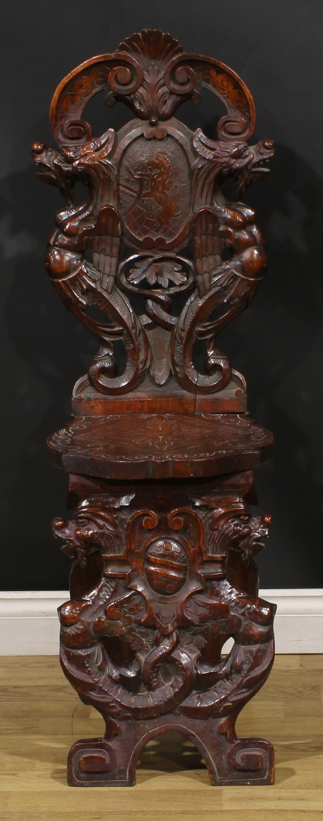 A pair of 19th century Italian walnut sgabelli or hall chairs, carved throughout in the - Image 2 of 9