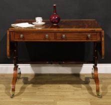 A Regency mahogany sofa table, rosewood crossbanded satinwood banded rounded rectangular top with