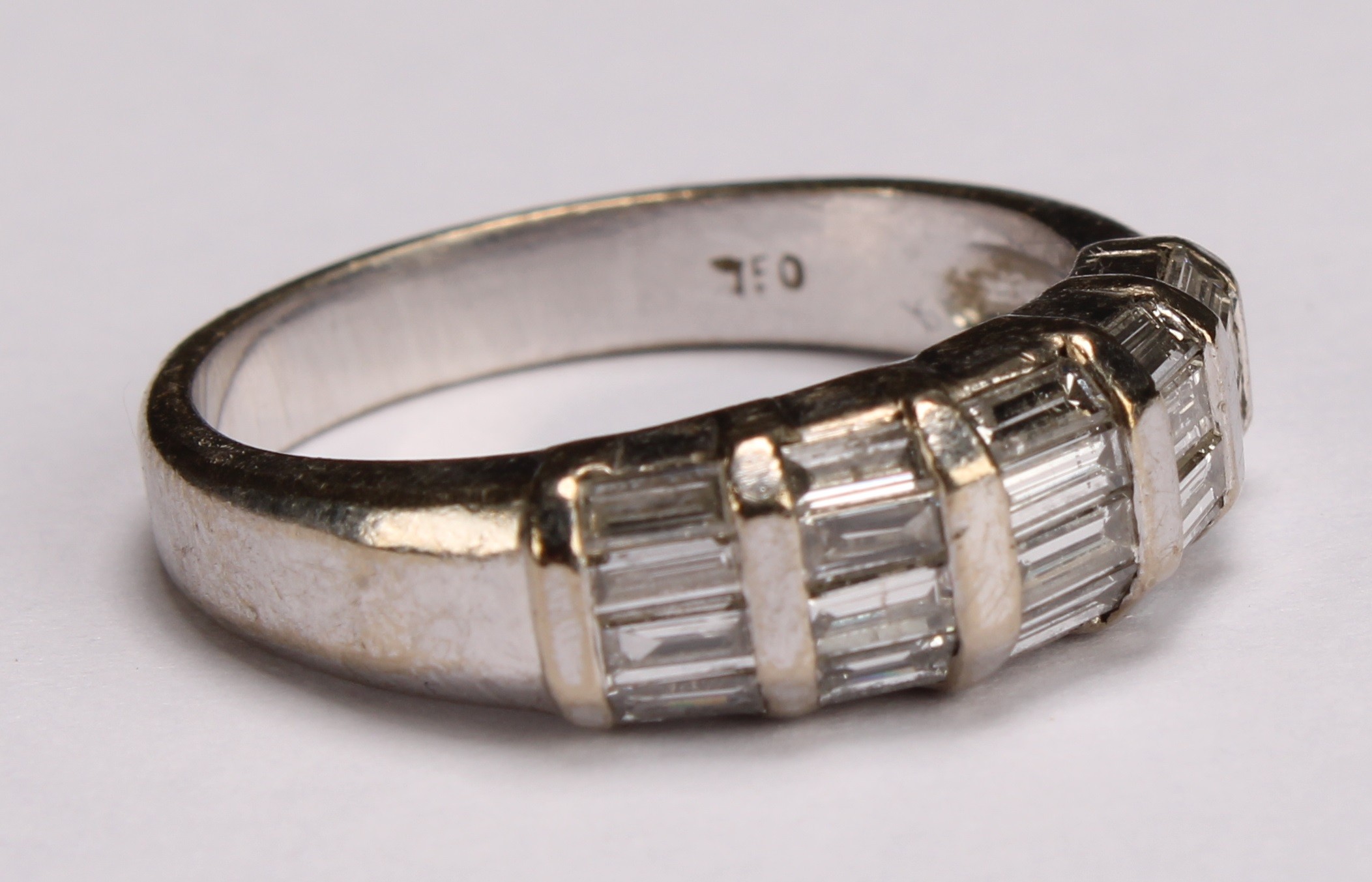 A diamond and 18ct white gold ring, with five bands of baguette cut stones, ring size M, 5.3g gross - Image 2 of 4