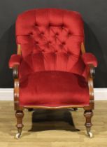 A Victorian mahogany library chair, stuffed-over upholstery, scroll hand rests, turned forelegs,