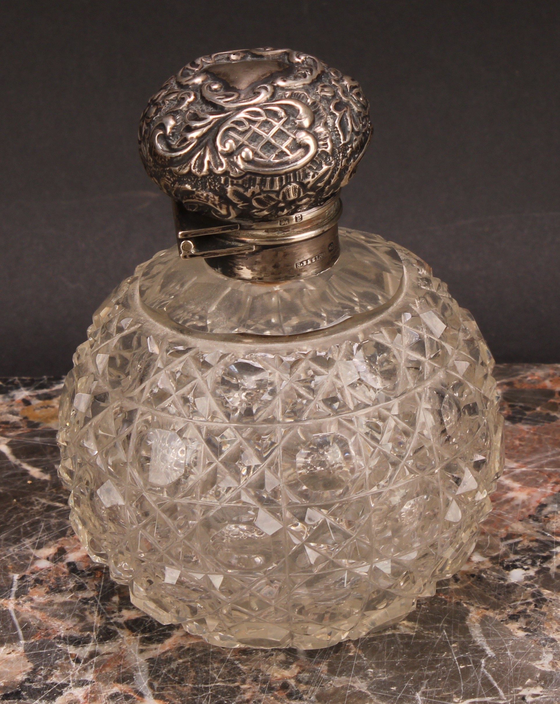 A Victorian silver mounted hobnail-cut globular scent bottle, hinged cover chased in the Rococo - Image 2 of 5