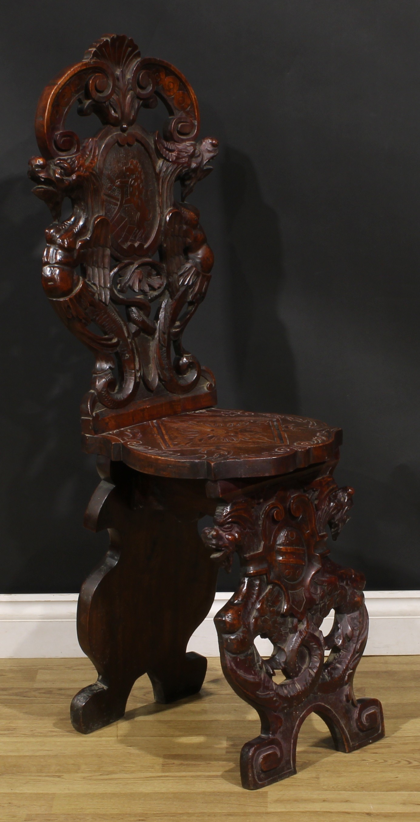 A pair of 19th century Italian walnut sgabelli or hall chairs, carved throughout in the - Image 3 of 9