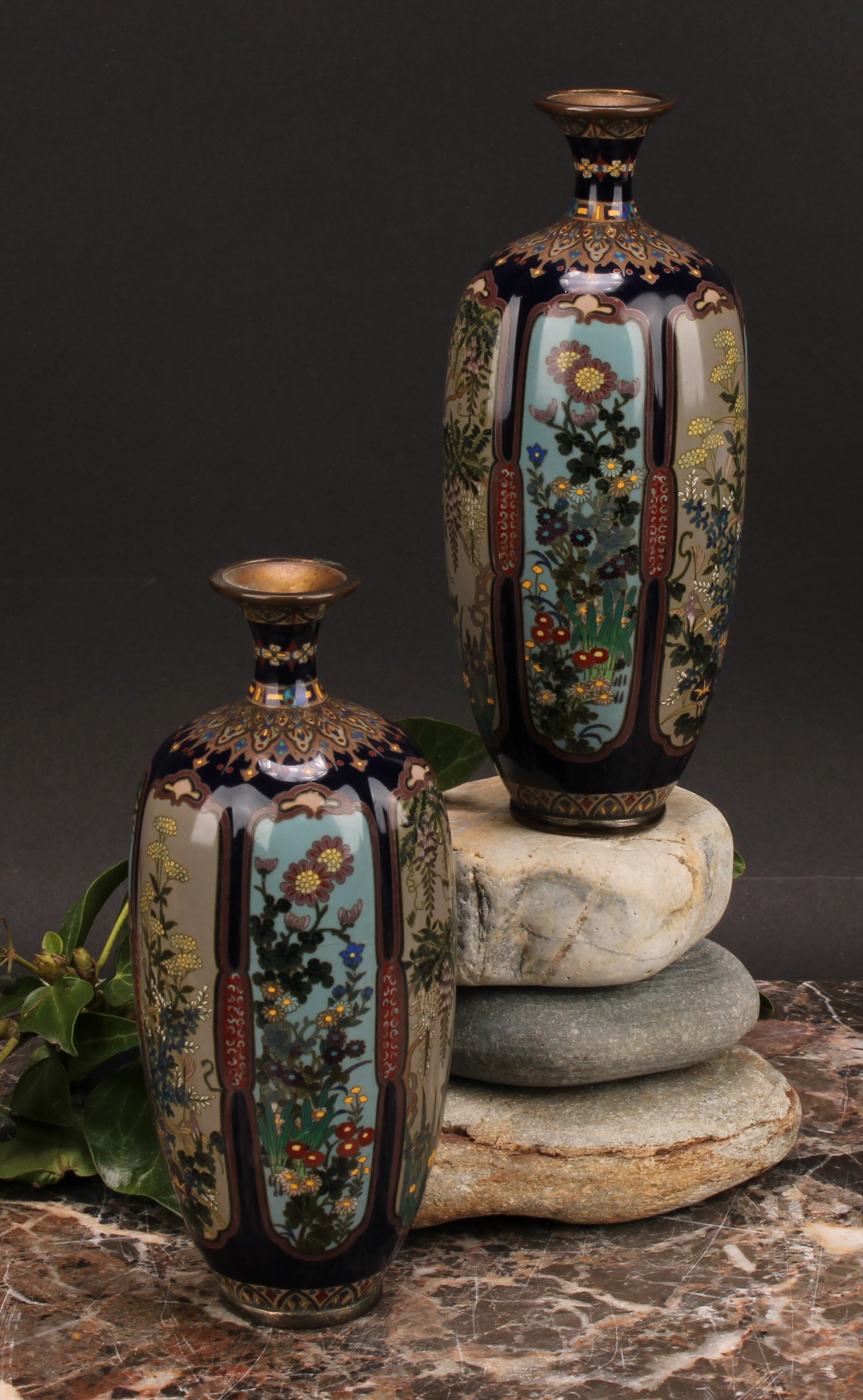 A pair of Japanese cloisonne enamel lobed ovoid vases, painted in polychrome with flowers within
