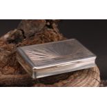 A 19th century Austrian silver waisted rectangular snuff box, hinged cover chased with radiating