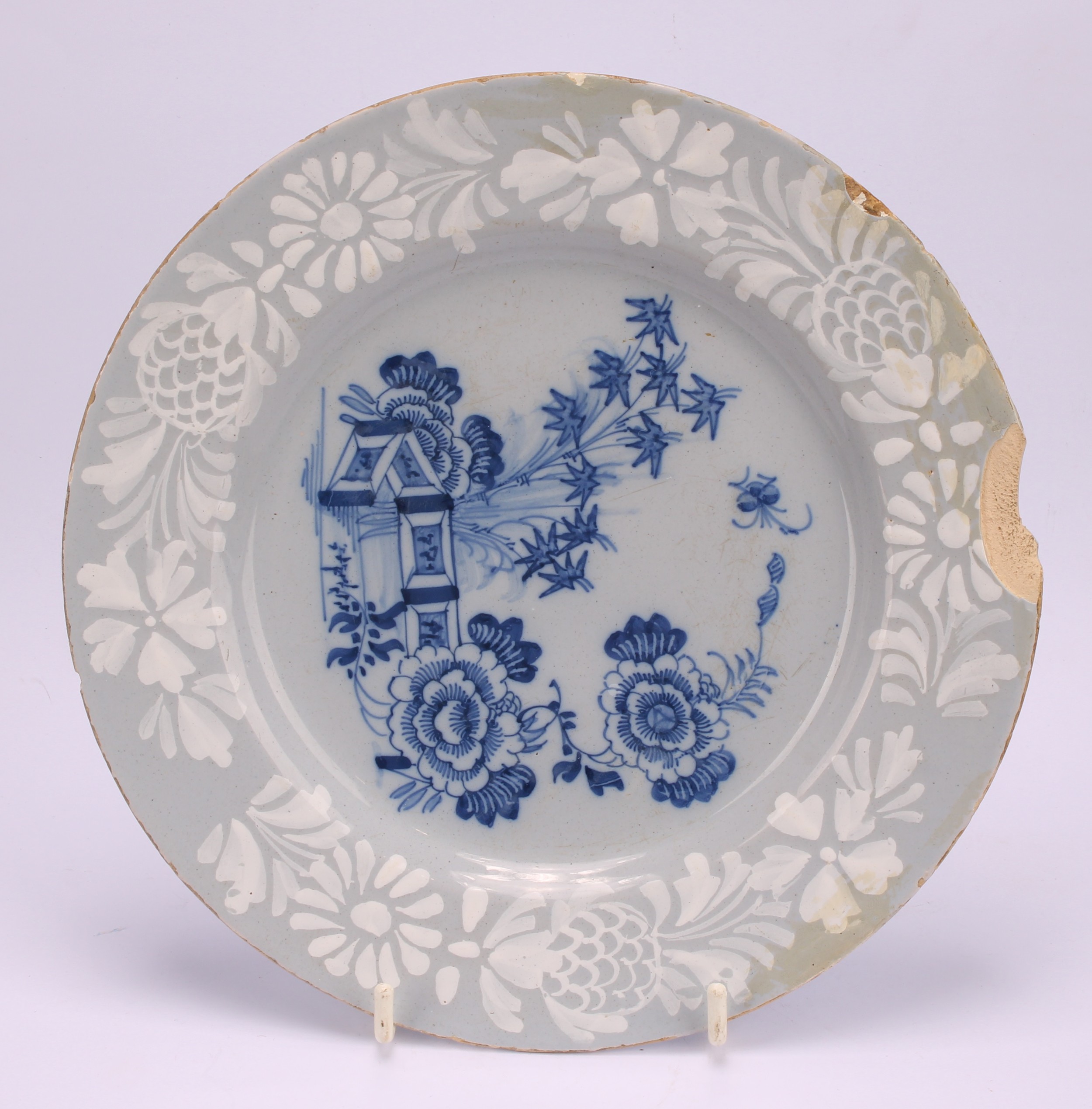 An 18th century Delft circular plate, painted in the chinoiserie taste with a figure in a Chinese - Image 15 of 18