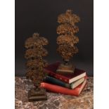 A pair of post-Regency bronze letter racks, each with four layered divisions embossed with flowers