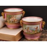 A pair of French porcelain ice pails or jardinieres, painted with courting putti, with river
