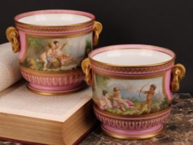 A pair of French porcelain ice pails or jardinieres, painted with courting putti, with river