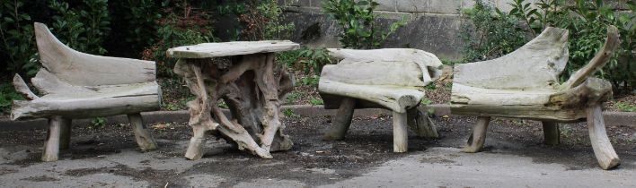 An Indonesian teak rootwood four-piece garden suite, comprising table and chairs, the table 78cm