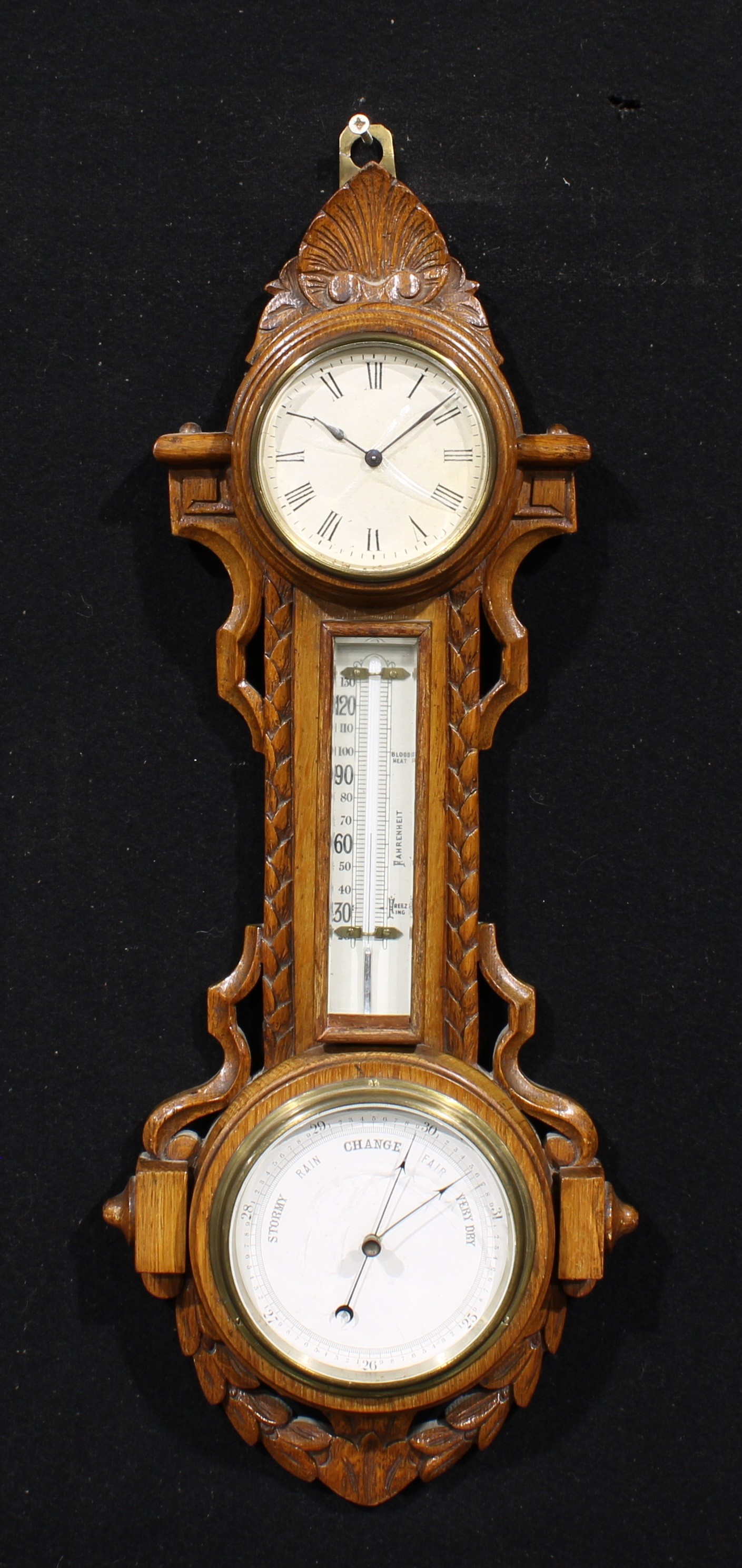 A late Victorian oak wall hanging combination timepiece, aneroid barometer and thermometer, 9cm