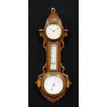 A late Victorian oak wall hanging combination timepiece, aneroid barometer and thermometer, 9cm