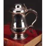 An early George III silver baluster tankard, hinged domed cover, chair-back thumbpiece, scroll