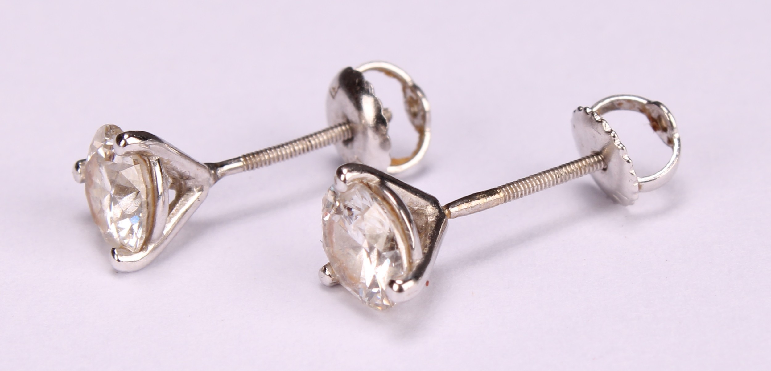 A pair of 14ct white gold diamond stud earring, each diamond approx. 5.8mm, approx. total weight 1. - Image 3 of 4