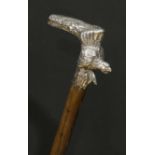 An early 20th century silver mounted novelty walking stick, probably Austro-Hungarian, the L-