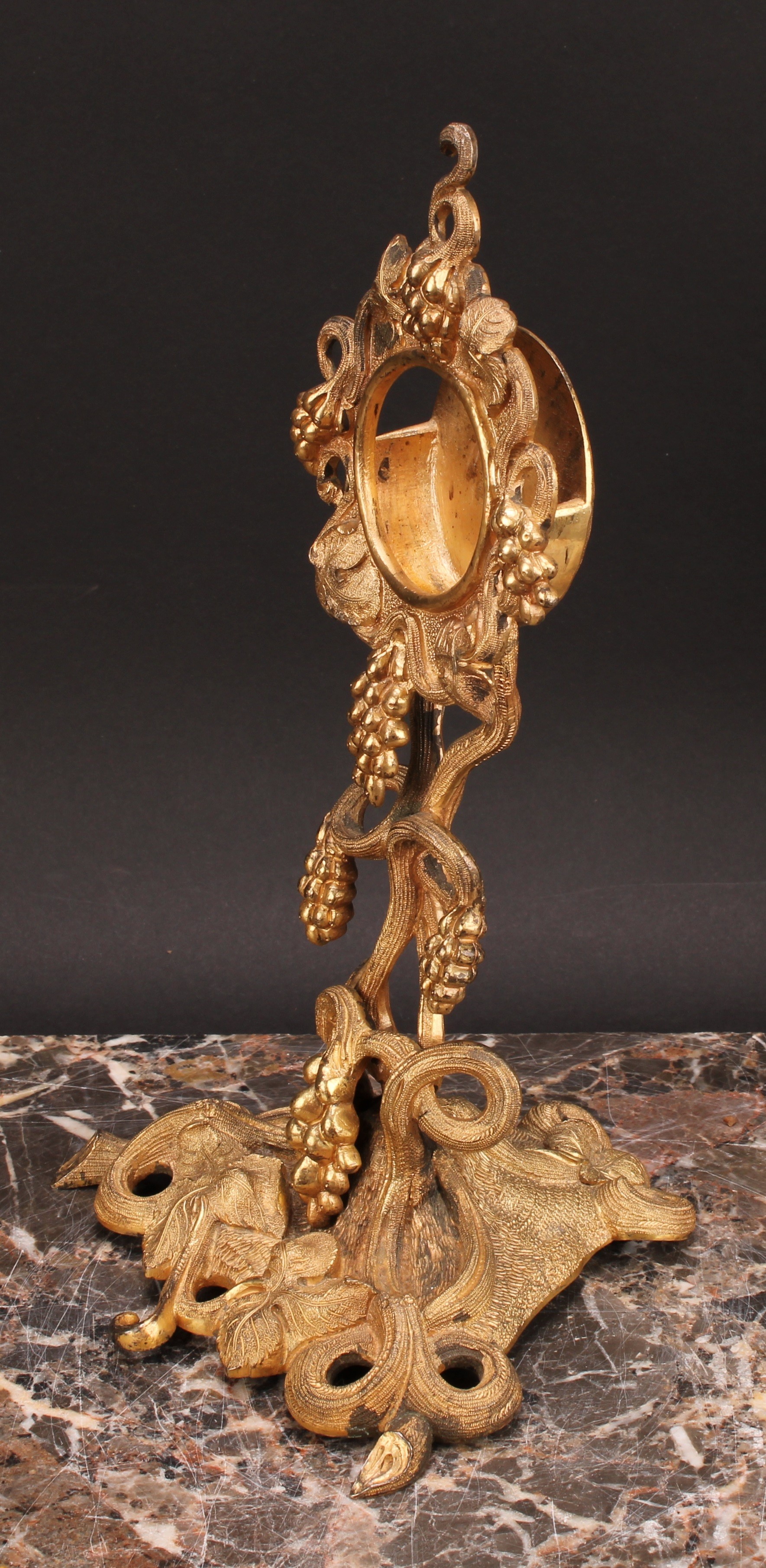 An early 20th century gilt metal pocket watch stand, cast throughout with fruiting vine, triform - Image 3 of 4