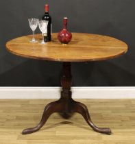 A George III mahogany tripod occasional table, circular tilting top, baluster column, cabriole legs,