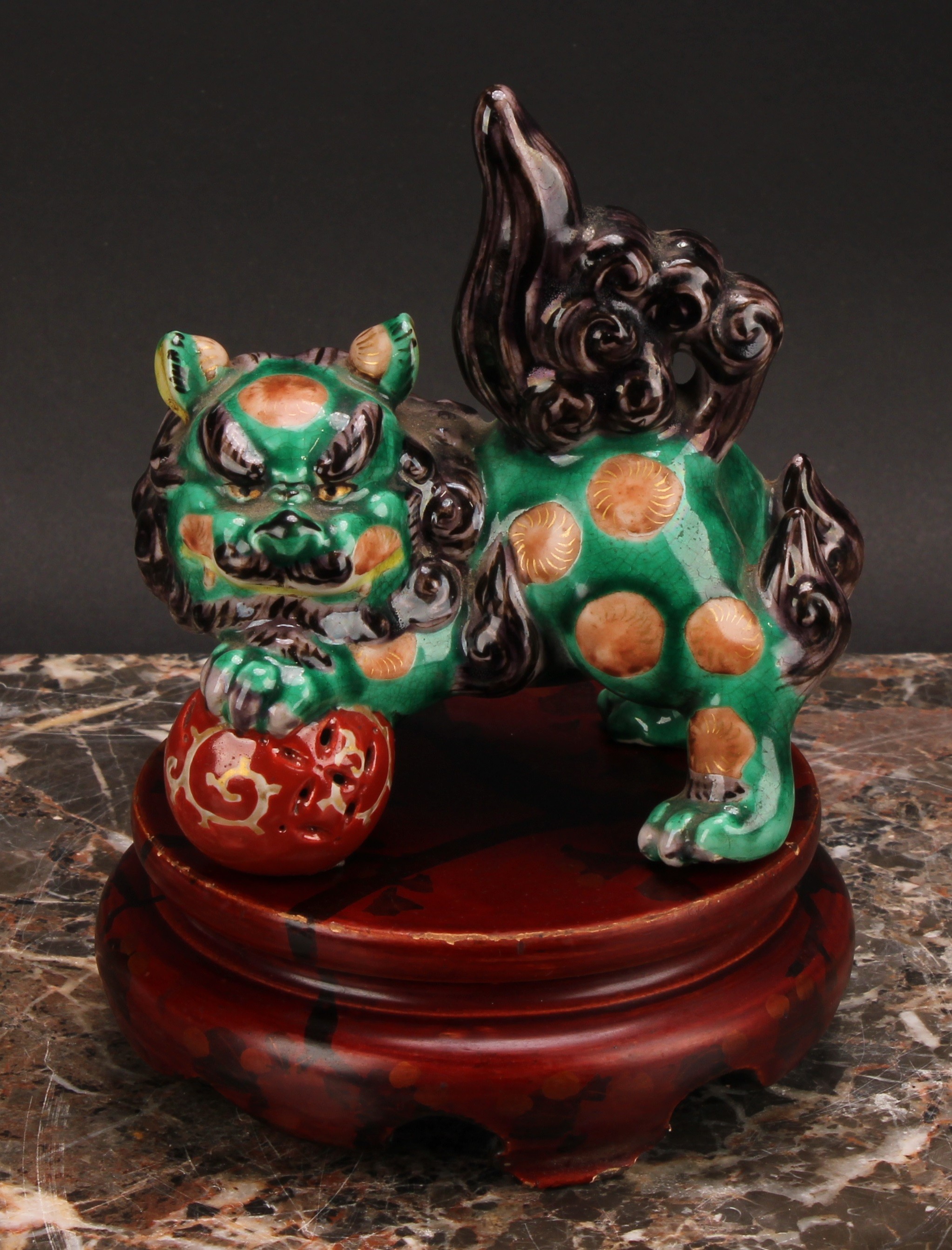 A Japanese porcelain model, of a temple lion, glazed in monochrome tones, 12.5cm wide, lacquer - Image 2 of 5