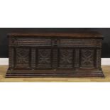 A late 17th century Flemish oak blanket chest, hinged top enclosing a till and ledge, the four-panel