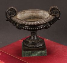 A 19th century dark patinated bronze shallow campana mantel urn, scroll handles, 15.5cm high overall