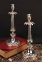 A pair of Italian silver table candlesticks, campana sconces, stiff leaf drip pans, fluted pillars