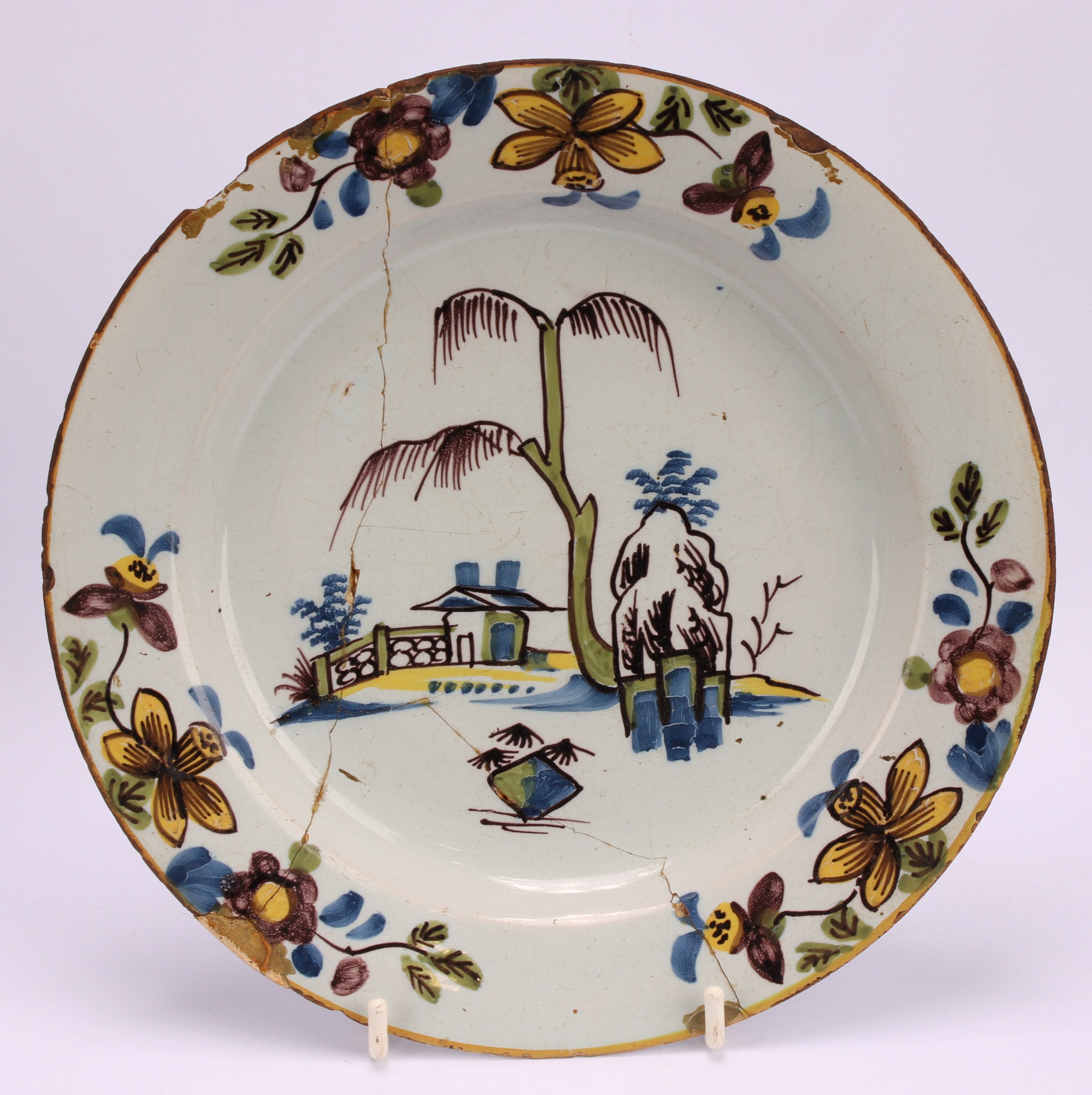 An 18th century Delft circular plate, painted in the chinoiserie taste with a figure in a Chinese - Image 3 of 18