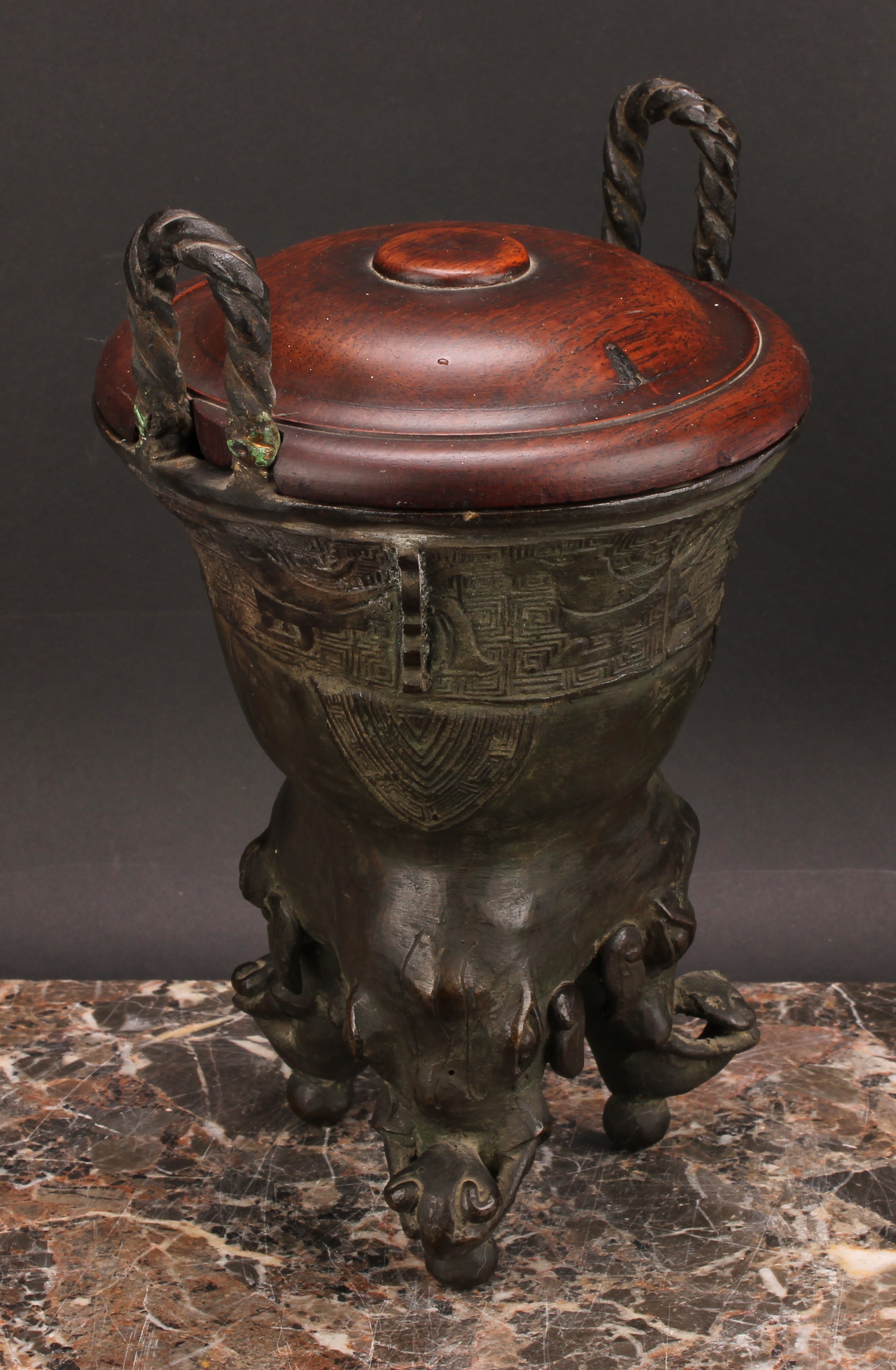 A Chinese patinated bronze ding censer, cast in the archaic manner, twist handles, outswept rim, - Image 3 of 5