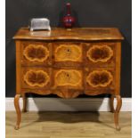 An 18th century style Italian walnut serpentine commode, oversailing top above a pair of long