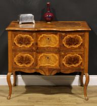 An 18th century style Italian walnut serpentine commode, oversailing top above a pair of long