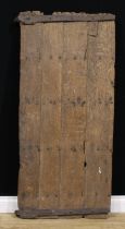 A Post-Medieval oak four-plank door, wrought iron hinges, 143cm high, 65cm wide excluding hinges,