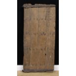 A Post-Medieval oak four-plank door, wrought iron hinges, 143cm high, 65cm wide excluding hinges,