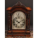A Victorian walnut bracket clock, 15cm arched silvered dial profusely engraved with scrolling