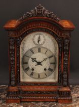 A Victorian walnut bracket clock, 15cm arched silvered dial profusely engraved with scrolling