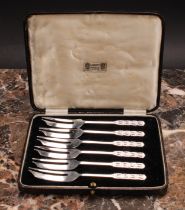 Liberty & Co - a set of six Arts and Crafts silver pastry forks, the terminals chased with