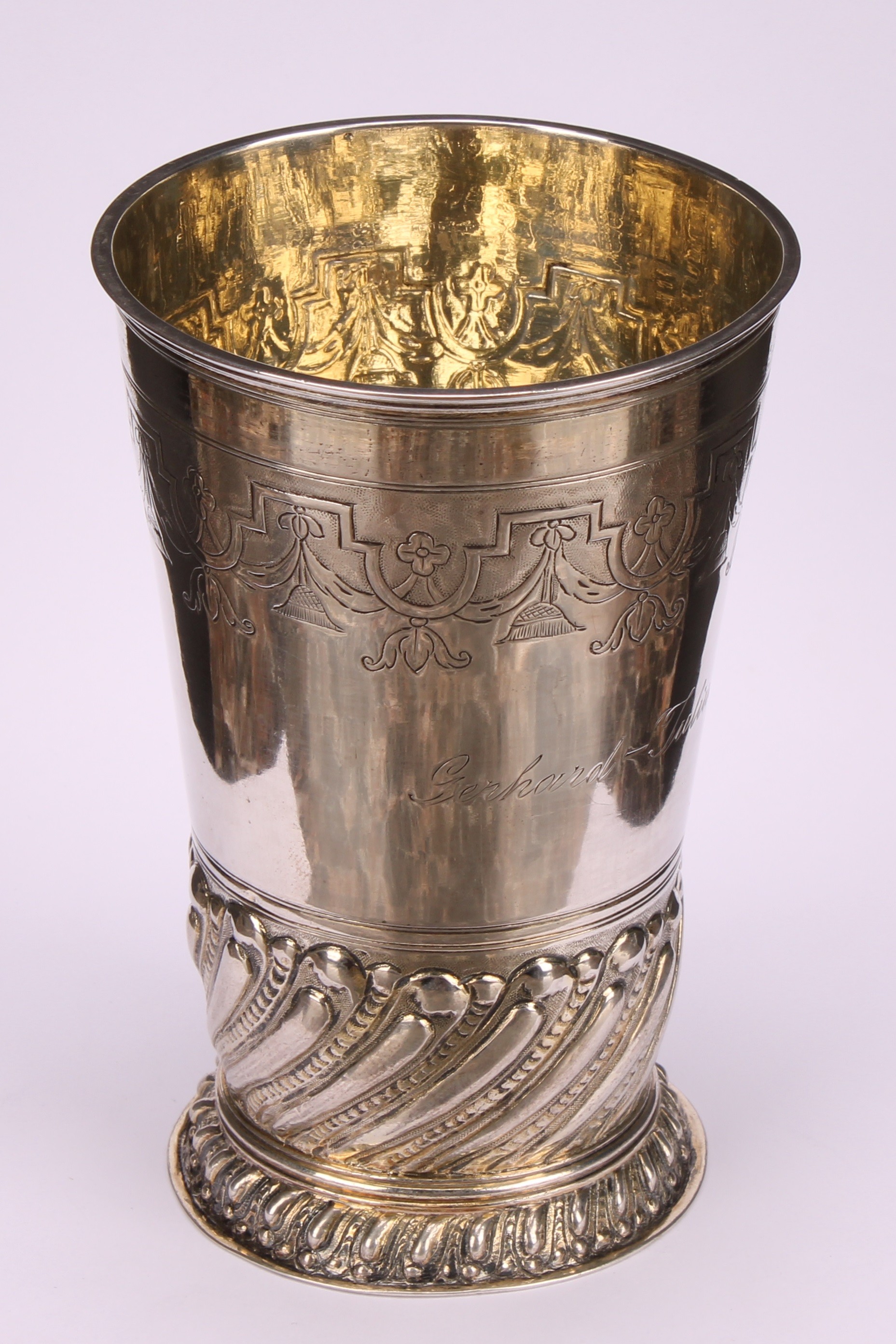 A German silver tapered cylindrical beaker, chased with a band of strapwork and leafy pendants, - Image 2 of 4