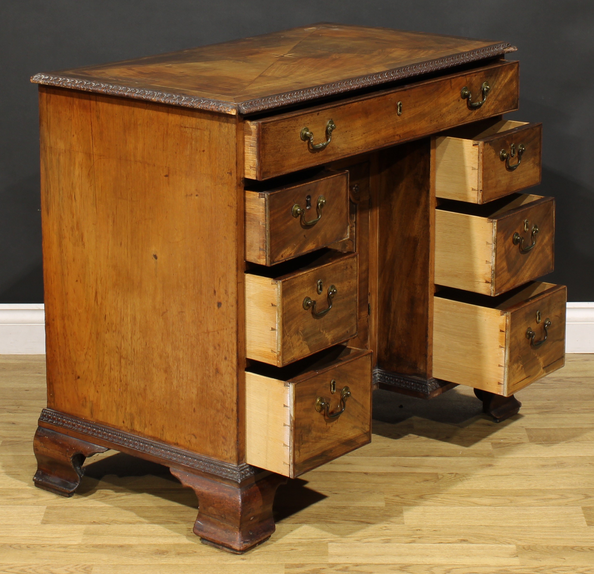 A George III mahogany kneehole desk, rectangular top with moulded foliate carved edge centred by a - Image 4 of 6