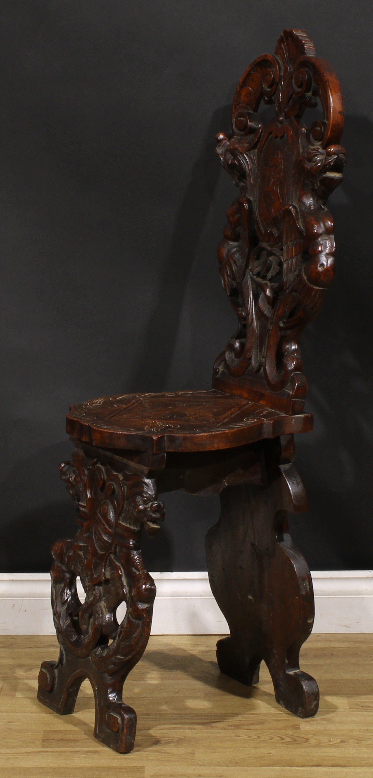 A pair of 19th century Italian walnut sgabelli or hall chairs, carved throughout in the - Image 8 of 9