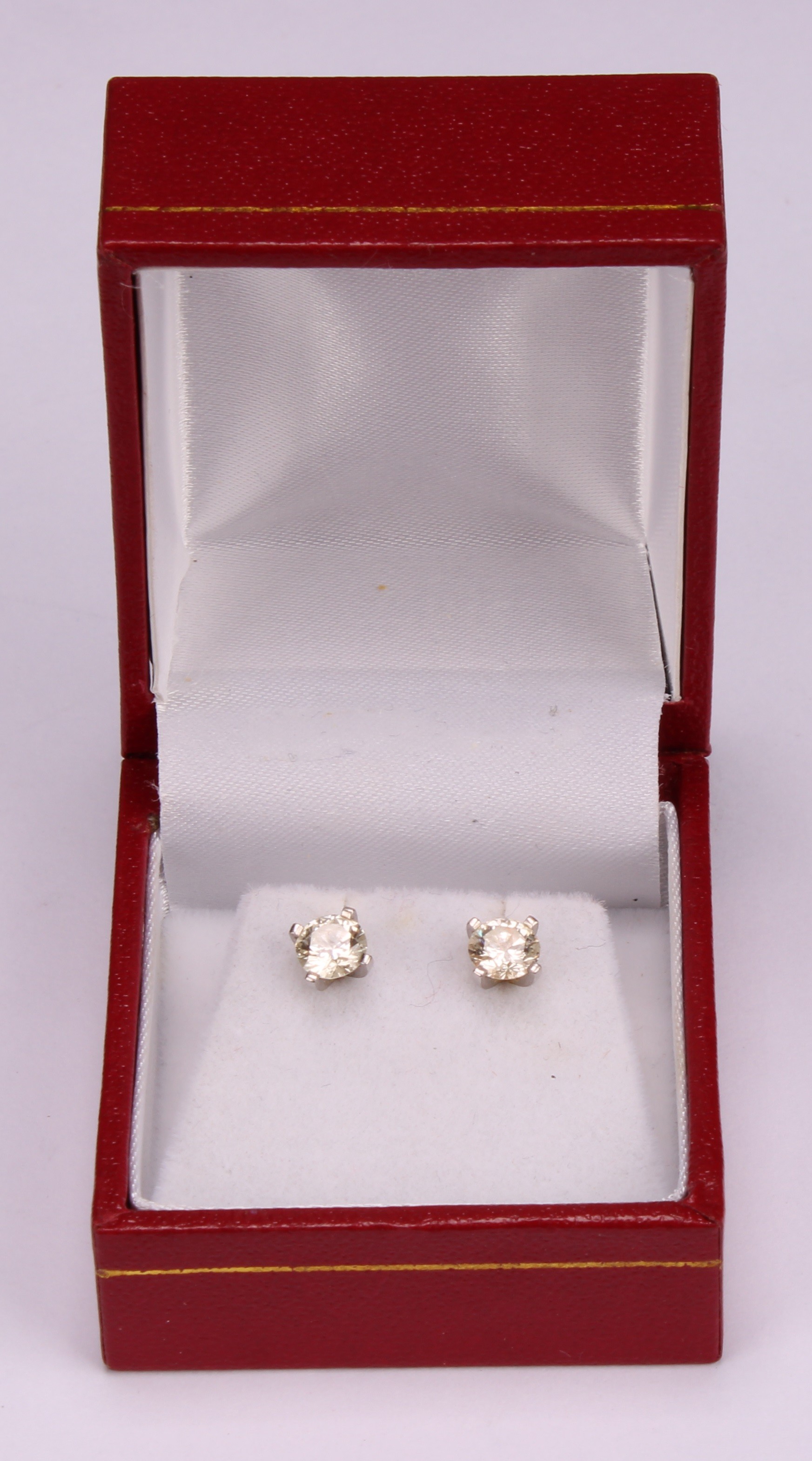 A pair of diamond stud earrings, the round brilliant cut stones claw set, platinum mounted, 1.7ct - Image 5 of 5