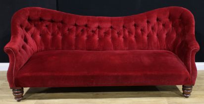 A Victorian drawing room sofa, stuffed-over upholstery, deep-button back, turned forelegs, Cope’s